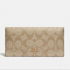 COACH Bifold Wallet in Signature Canvas